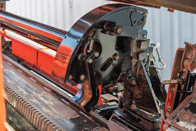2017 Ditch Witch JT30 drill frame close-up showing spindle, rack-and-pinion thrust system, and rotary drive head with hydraulic components