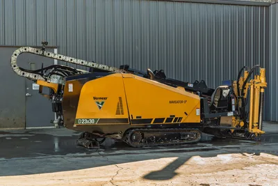 2021 Vermeer D23x30 S3 Navigator HDD rig, driver-side profile, rubber tracks, pipe rack, drill carriage, and cable carrier visible