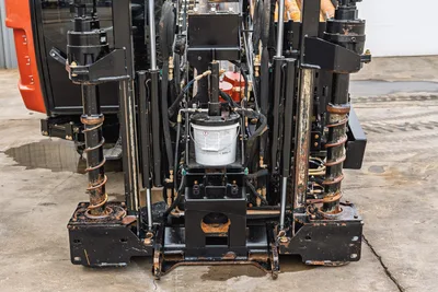 Rear view of 2021 Ditch Witch AT40 All Terrain HDD drill frame, rack assembly, stabilizers, and hydraulic components.