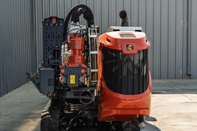 Rear view of 2020 Ditch Witch JT24 HDD drill showing engine compartment, carriage, rotation motor, and rubber tracks.