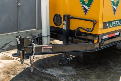 2024 Vermeer LP573SGT mud vacuum trailer hitch, safety chains, hydraulic jack, and enclosure detail. Excellent condition.