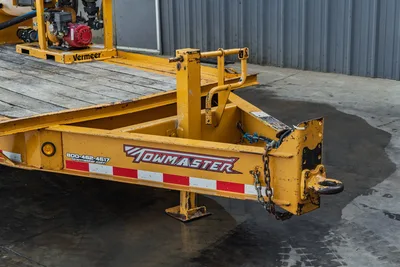 2021 TowMaster T-20D trailer tongue, pintle hitch, safety chains, jack stands, reflective tape; Vermeer MX125 mud mixer visible on deck