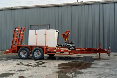 2019 Belshe WB14-2EP mud mixing trailer, driver-side view, white poly tank, Ditch Witch mixer, tandem axle, fold-down ramps