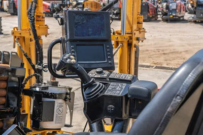 2020 Vermeer D24x40 S3 operator control console with dual displays, joystick, function buttons, and armrest on yellow drill frame